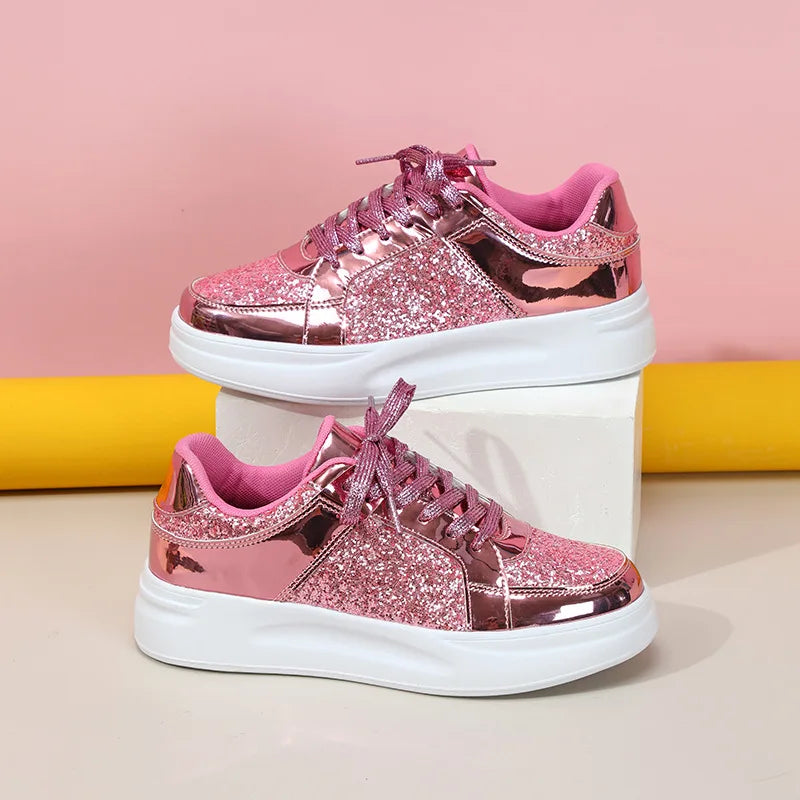 Pink sequin lace-up sneakers with metallic trim and thick white platform soles.