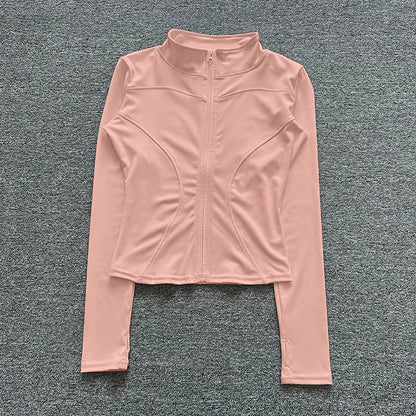 Light pink fitted zip-up sport jacket in stretchy polyester for gym training and yoga.