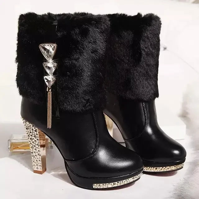 Black faux-leather winter ankle boots with faux fur cuffs, crystal triangle charms, rhinestone platforms, and high block heels.