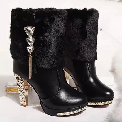 Black faux-leather winter ankle boots with faux fur cuffs, crystal triangle charms, rhinestone platforms, and high block heels.