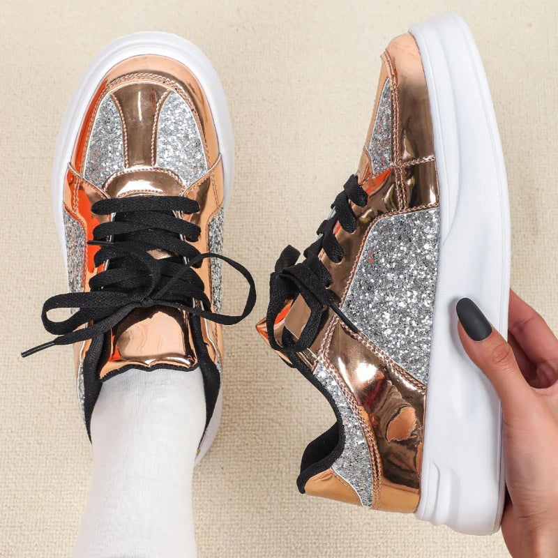 Rose gold and silver glitter casual sneakers with thick white soles and black laces.