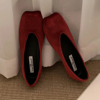 Deep red suede slip-on flats with square toes for comfortable daily wear.