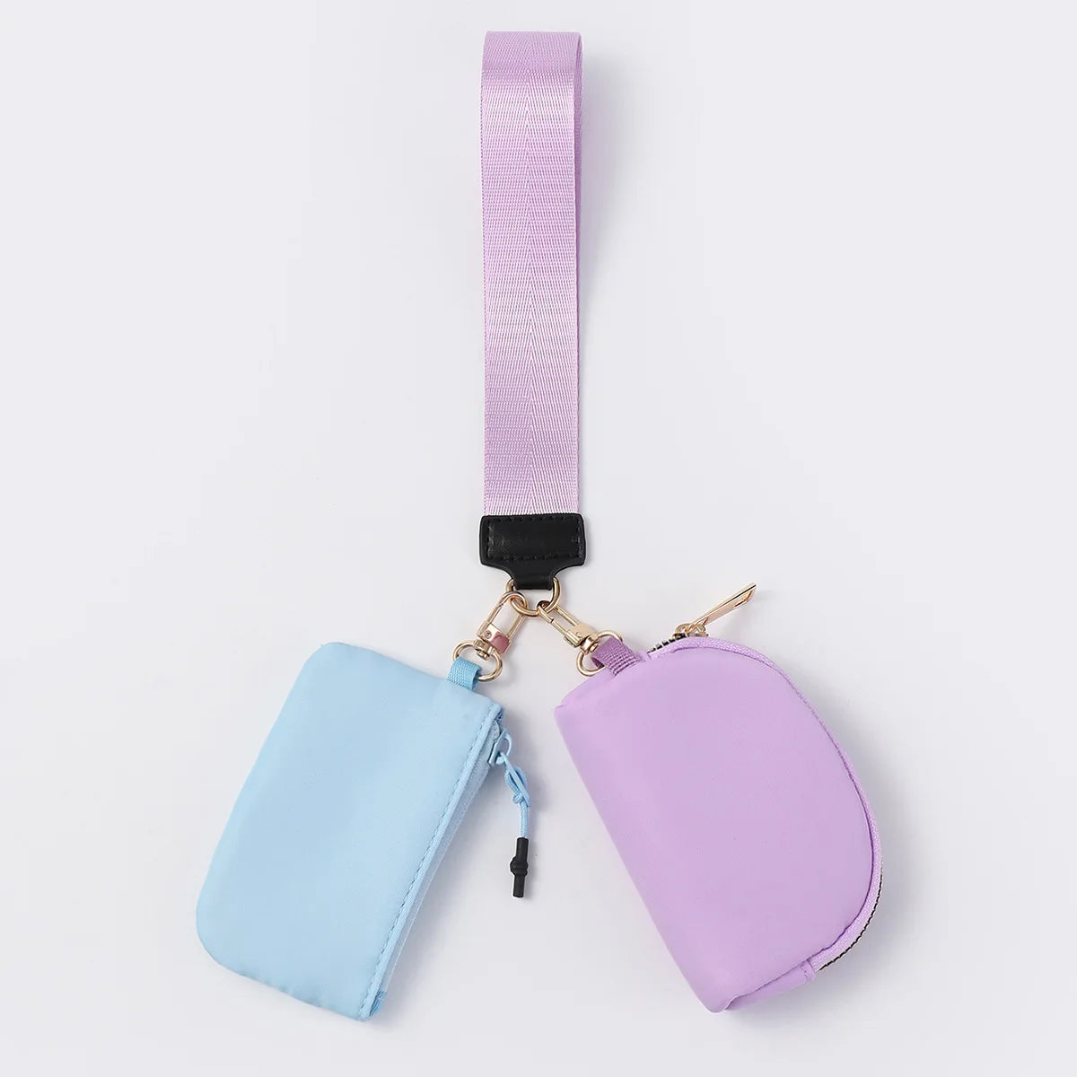 Blue and purple nylon zip closure multi-pocket wristlet for carrying cards and keys on the go.