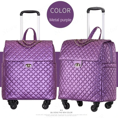 Metal purple quilted PU leather rolling luggage with a top handle, chain accent, turn-lock closure, and wheels.