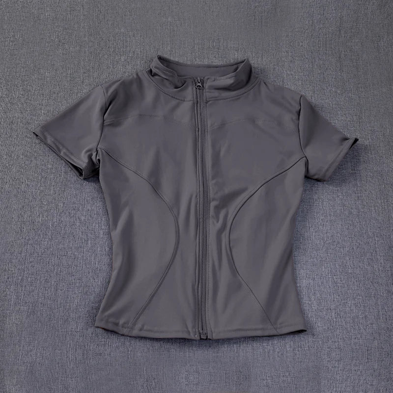 Grey short-sleeve, full-zip stand collar, sculpting yoga top with fitted seams for workout sessions.