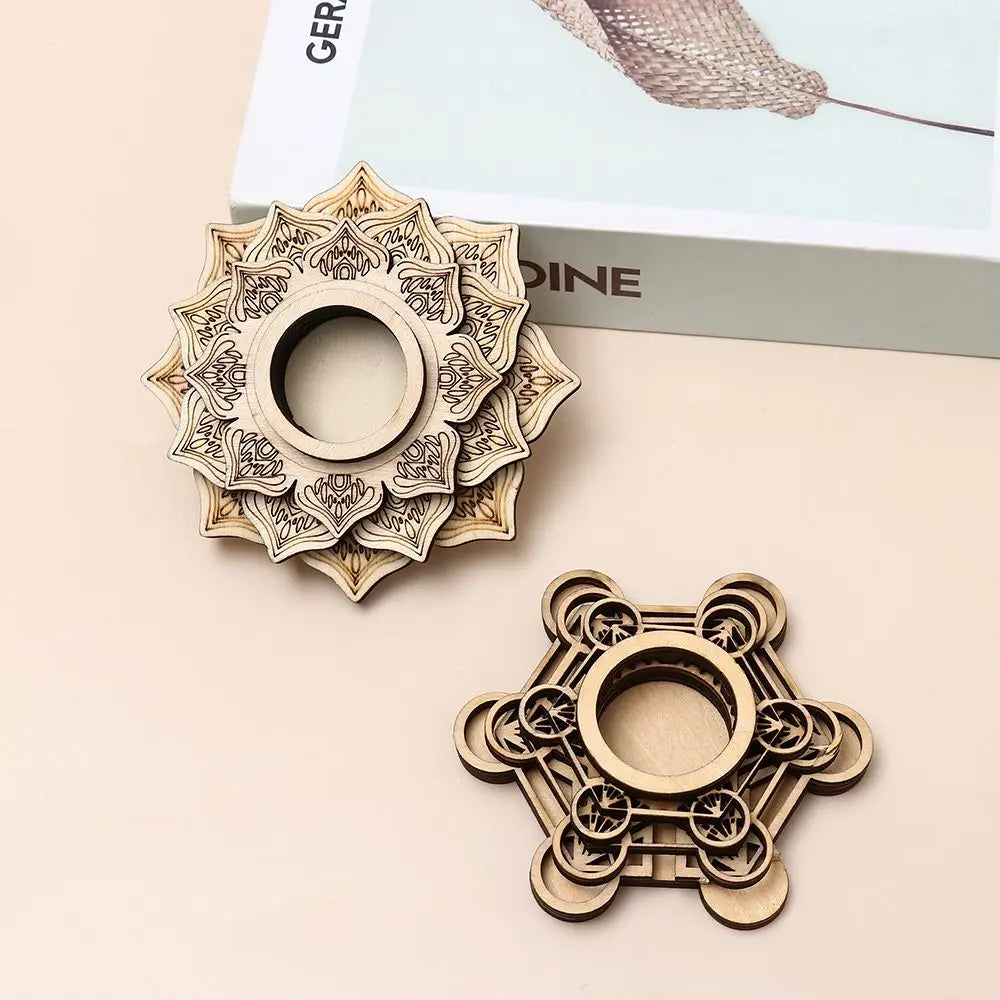 Two light brown wood carved crystal holders with intricate lotus and geometric patterns, featuring central circular bases.