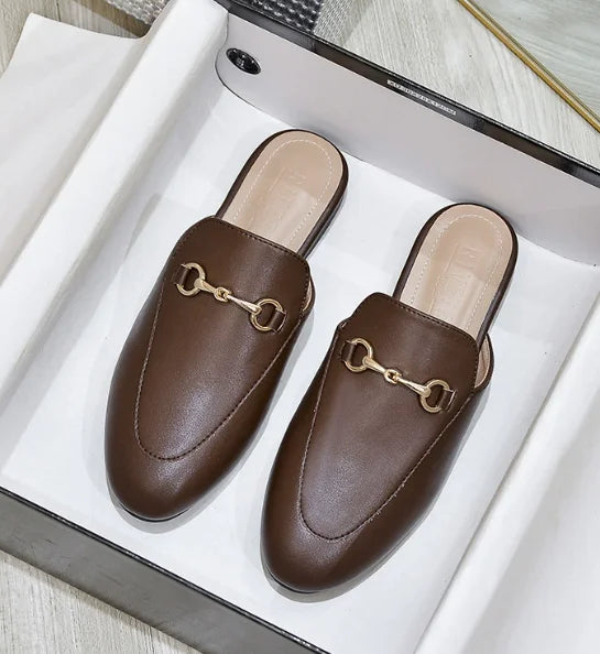 Brown slip-on mules with a gold metal chain detail for comfortable outdoor wear.