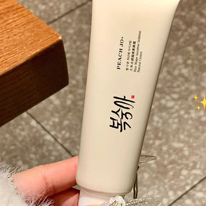 Beige, soft plastic squeeze tube of SPF50+ Rice Extract Moisturizing Cream with black text and Korean branding.
