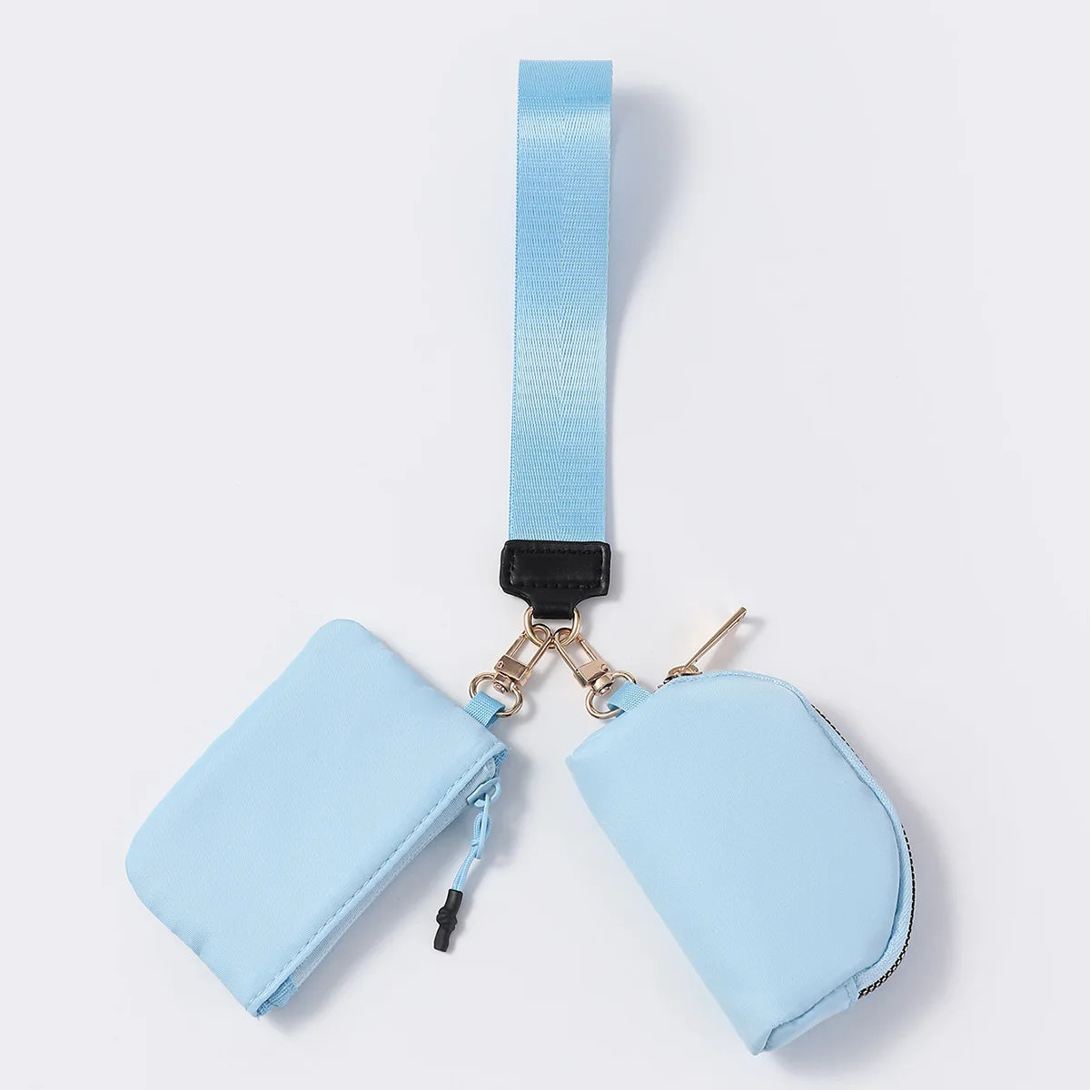 Light blue nylon dual pouch wristlet with zip closure for everyday organization.