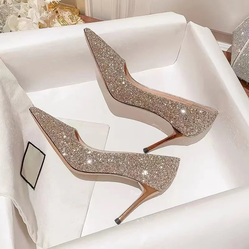 Gold glitter pointed-toe slim heel dress shoes for wedding events.