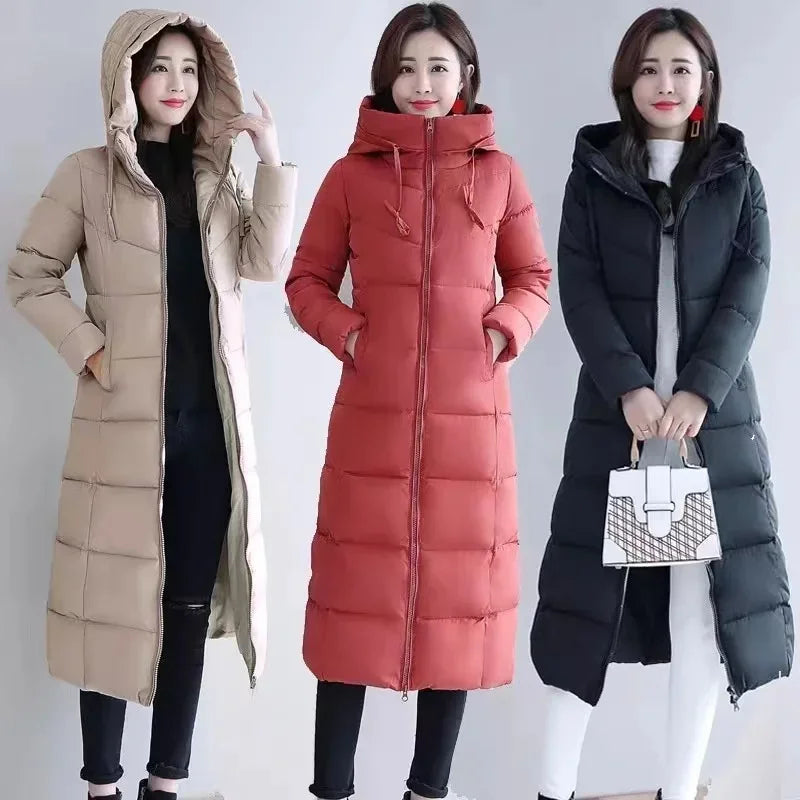 Three models in long, quilted, hooded winter parkas: khaki on left, brick red in center, and black on right.
