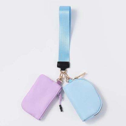 Lavender and blue nylon dual pouch wristlet wallet with zip closure for holding cards and coins on the go.