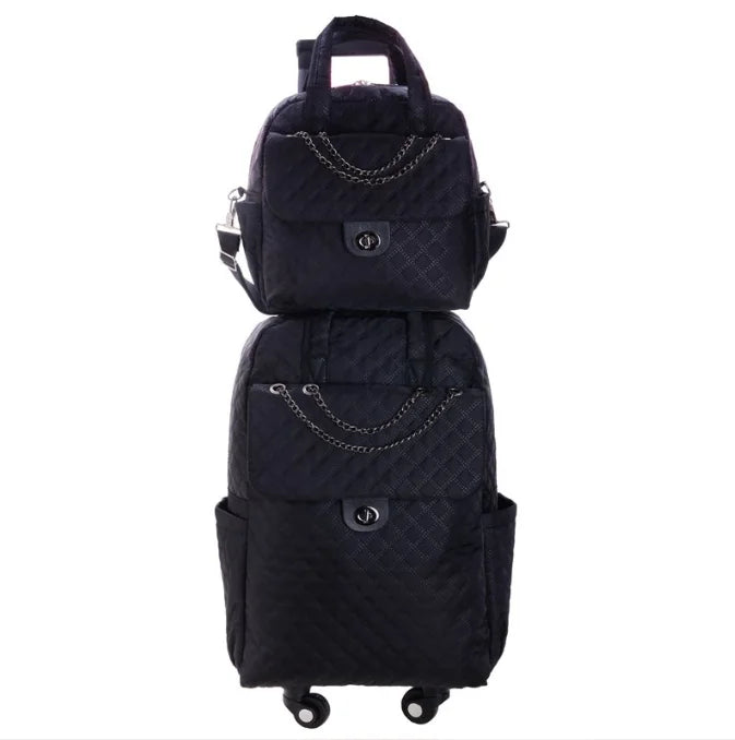 Black quilted rolling backpack and matching handbag set with chain accents and turn-lock closures.