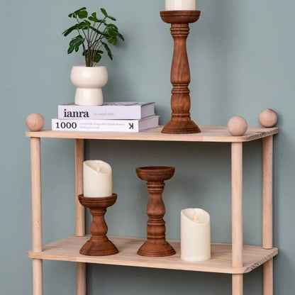 Home decor wooden pillar candle holders trio set on a wooden shelf display