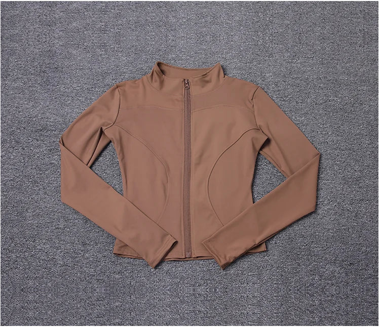 Brown polyester fitted sport jacket with a zip closure and high collar for gym training.