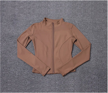 Brown polyester fitted sport jacket with a zip closure and high collar for gym training.