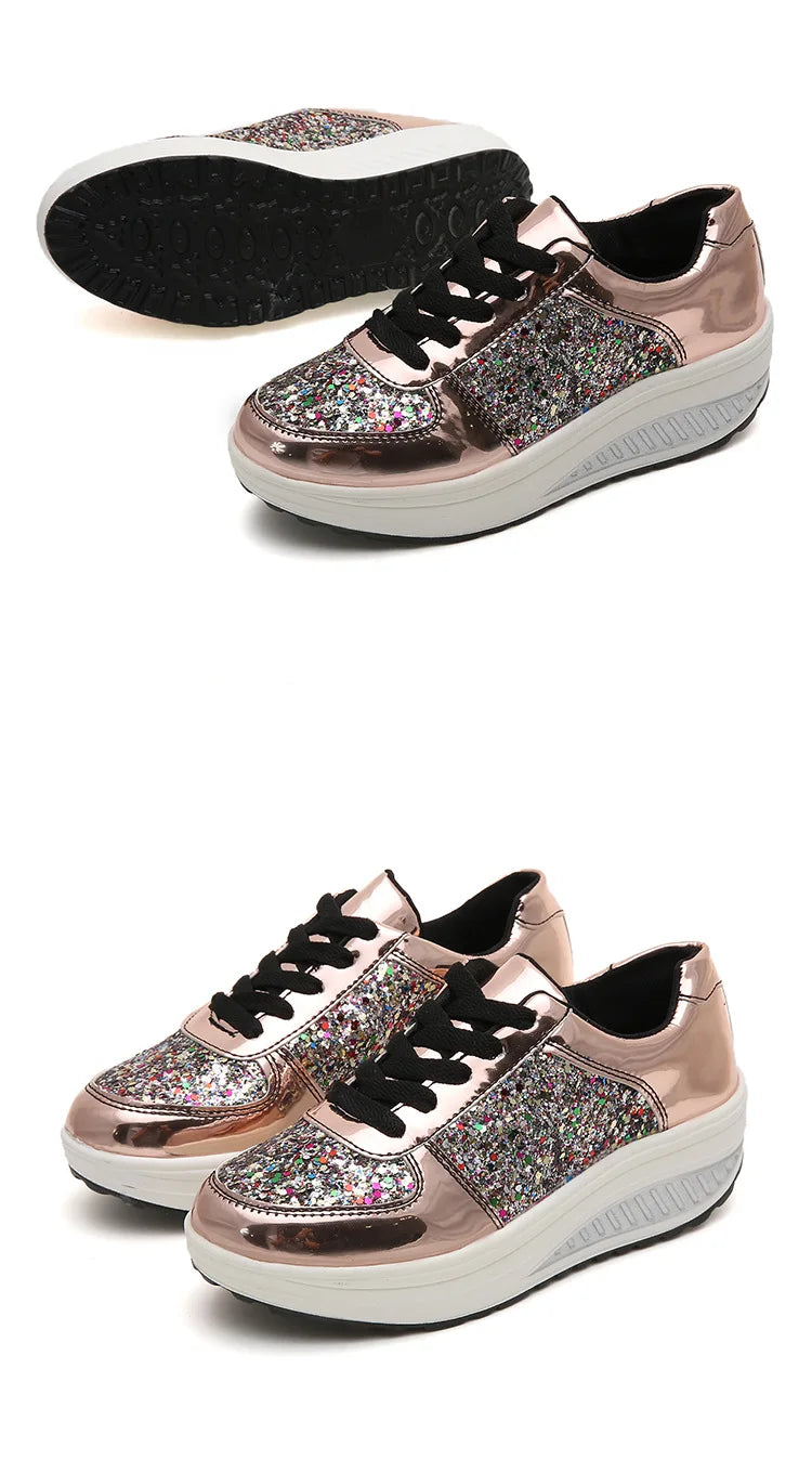 Rose gold platform wedge sneakers with metallic finish, multicolor glitter panels, black laces, and thick white soles.