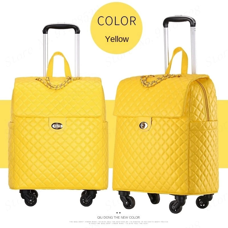 Two yellow quilted PU leather retro rolling suitcases with gold chain detail, turn-lock closures, and telescoping handles.