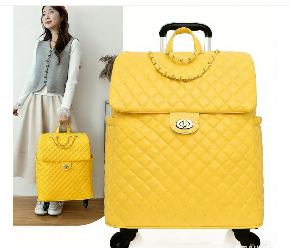 Yellow quilted PU leather wheeled travel bag with gold chain accent and twist-lock closure.