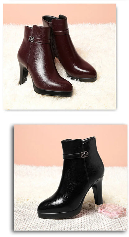Burgundy and black crocodile-patterned leather ankle boots with high block heels, platform soles, and rhinestone ankle straps.
