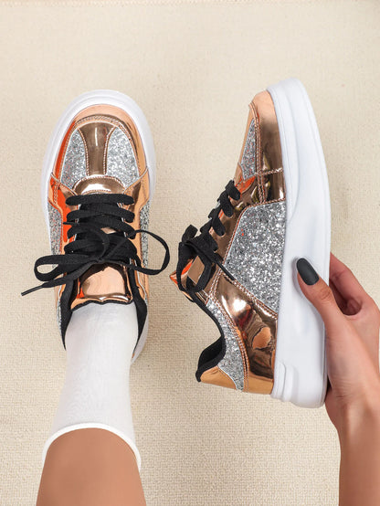 Rose gold and silver glitter casual sneakers with thick white soles and black laces.