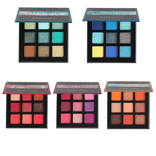 Five open nine-pan eyeshadow palettes with various matte and shimmer shades.