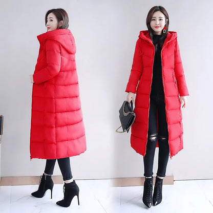Red long puffer down coat with hood, quilted design, and full zipper, worn by a woman.