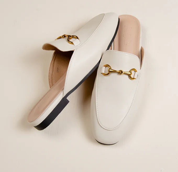 White slip-on mules with gold metal chain detail for everyday outdoor wear.
