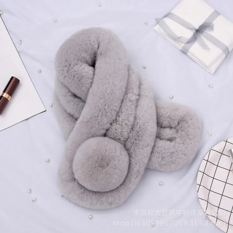 Grey rabbit fur scarf in a short, triple-tube style featuring a round pom-pom detail.