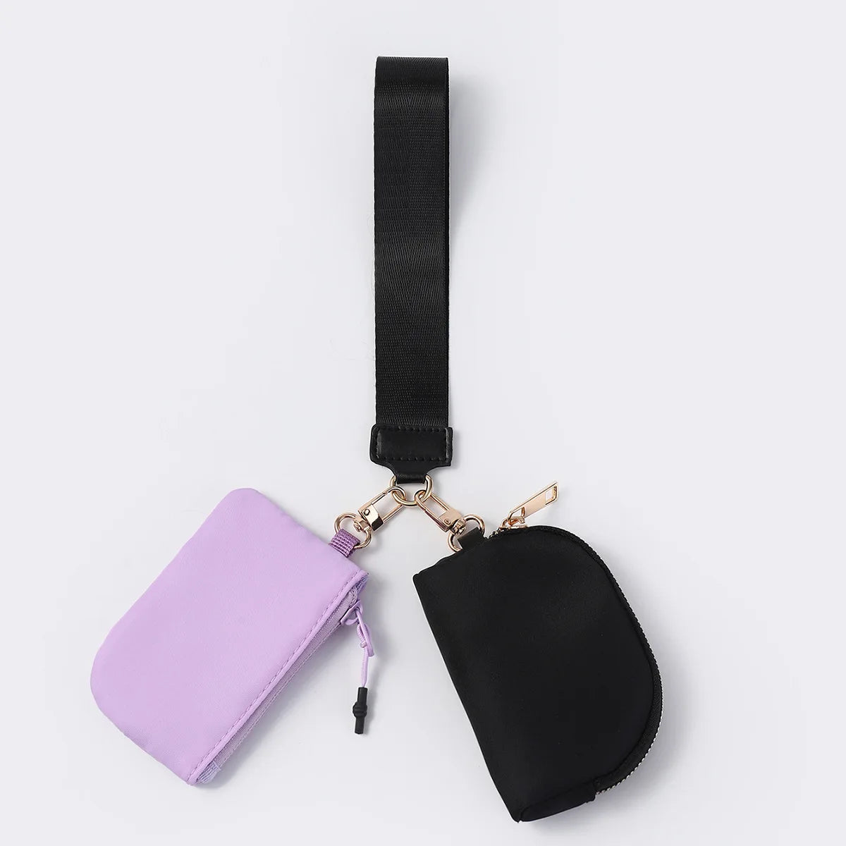 Purple and black nylon dual pouch with zip closure and wristlet strap for organized daily carry.