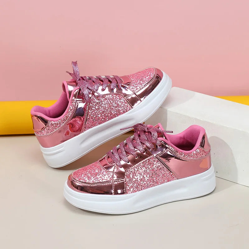 Pink glitter and metallic casual lace-up sneakers with thick white soles.