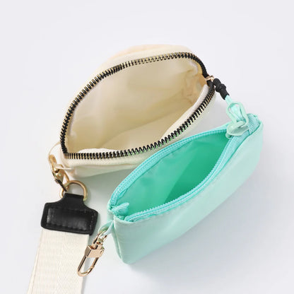 Cream and mint nylon dual pouch wristlet wallet with zip closure for holding cards and coins while on the go.