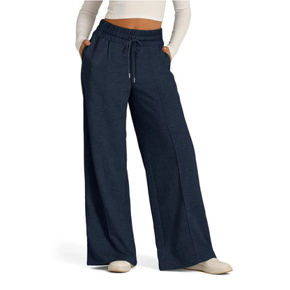 Navy blue fleece-lined high waist flowy pants with a drawstring, useful for staying warm throughout the day.