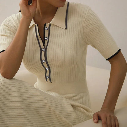Cream ribbed knit dress with navy trim and buttons, a fitted polo style for daily wear.
