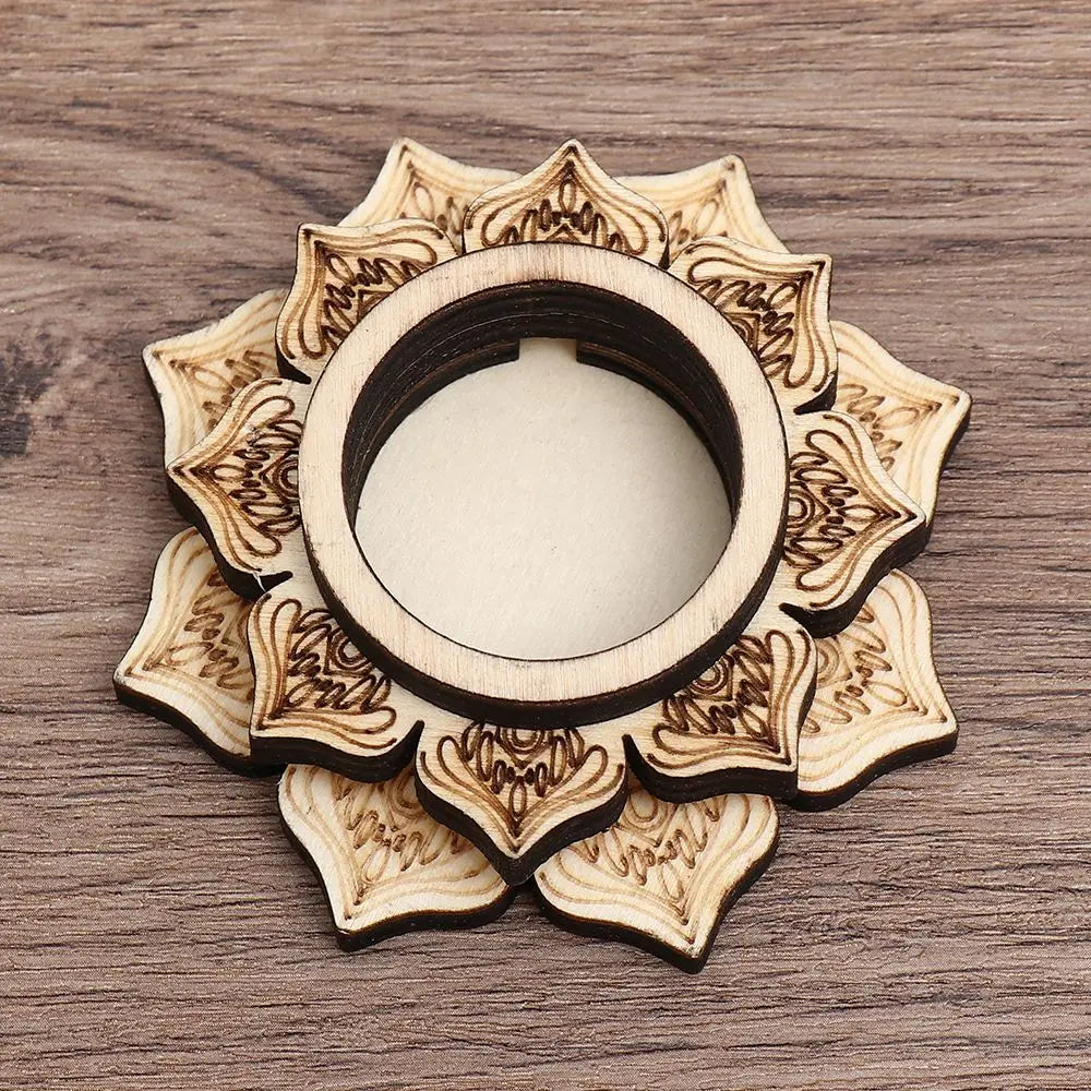 Light wood crystal ball holder shaped like a layered lotus flower with burned-in floral patterns.