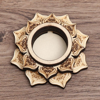 Light wood crystal ball holder shaped like a layered lotus flower with burned-in floral patterns.