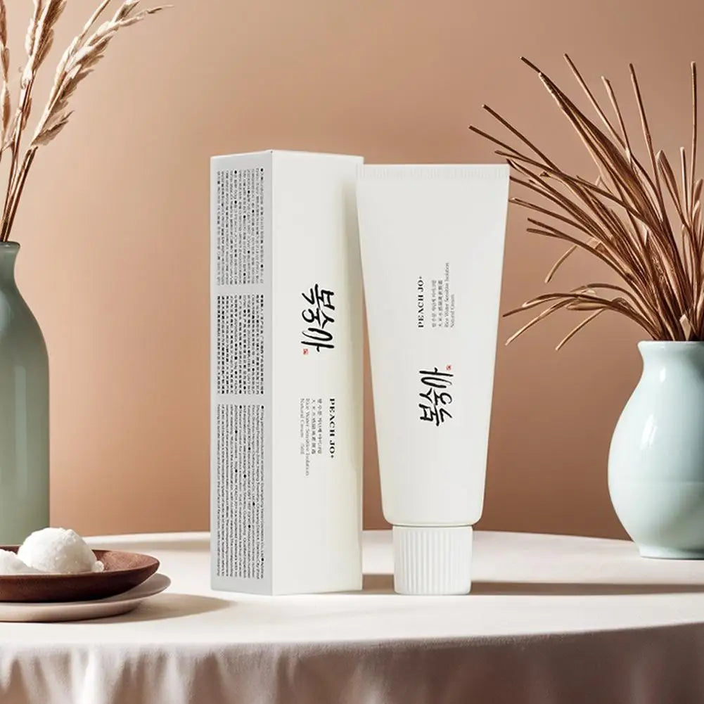 White 50g SPF50+ rice extract moisturizing cream tube and matching box with black text.