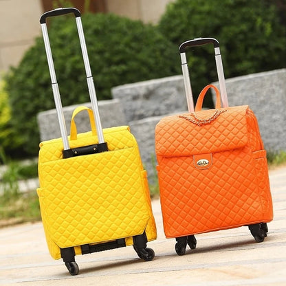 Two retro quilted PU rolling suitcases in yellow and orange with retractable handles and wheels.