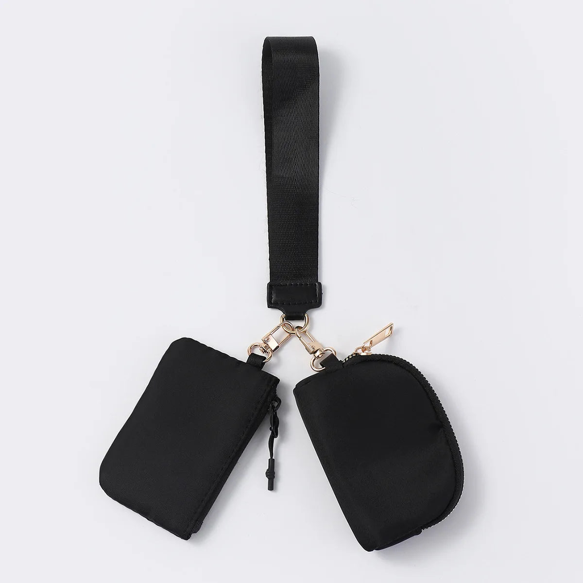 Black nylon dual pouch wristlet wallet with zip closures for everyday organization.