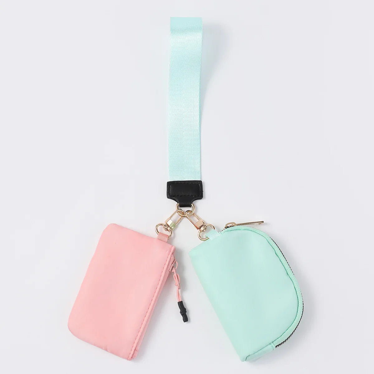 Pink and mint nylon zip closure wristlet wallet with dual pouches for daily errands.