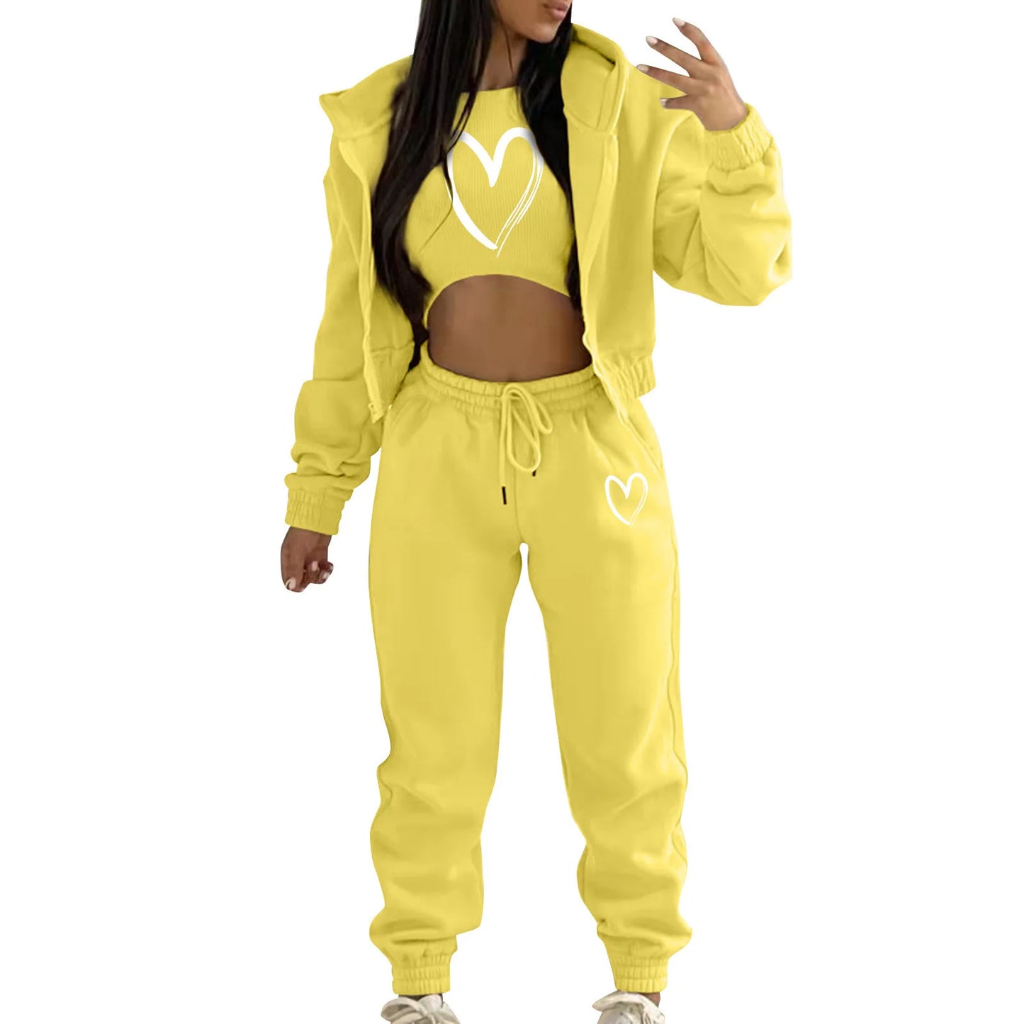 Yellow knit sweater set with white heart print, hooded jacket, and high waist joggers for a comfortable lounge outfit.
