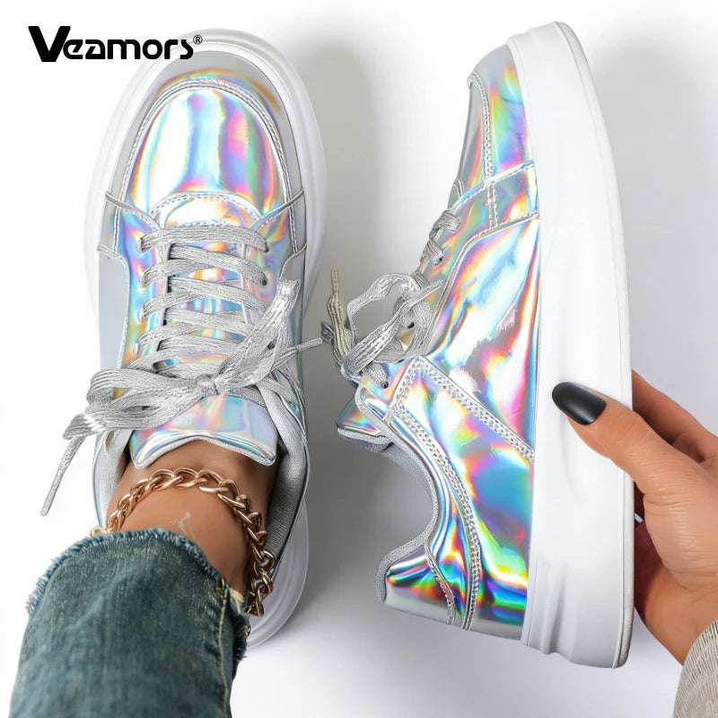 Silver holographic lace-up casual sneakers with thick white soles.