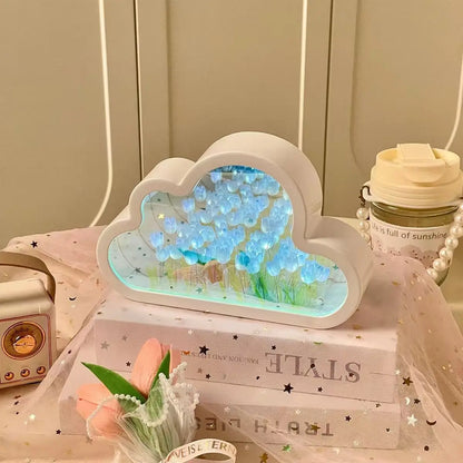 Cloud-shaped mirror panel with blue tulip LED home decor for ambient desk lighting.