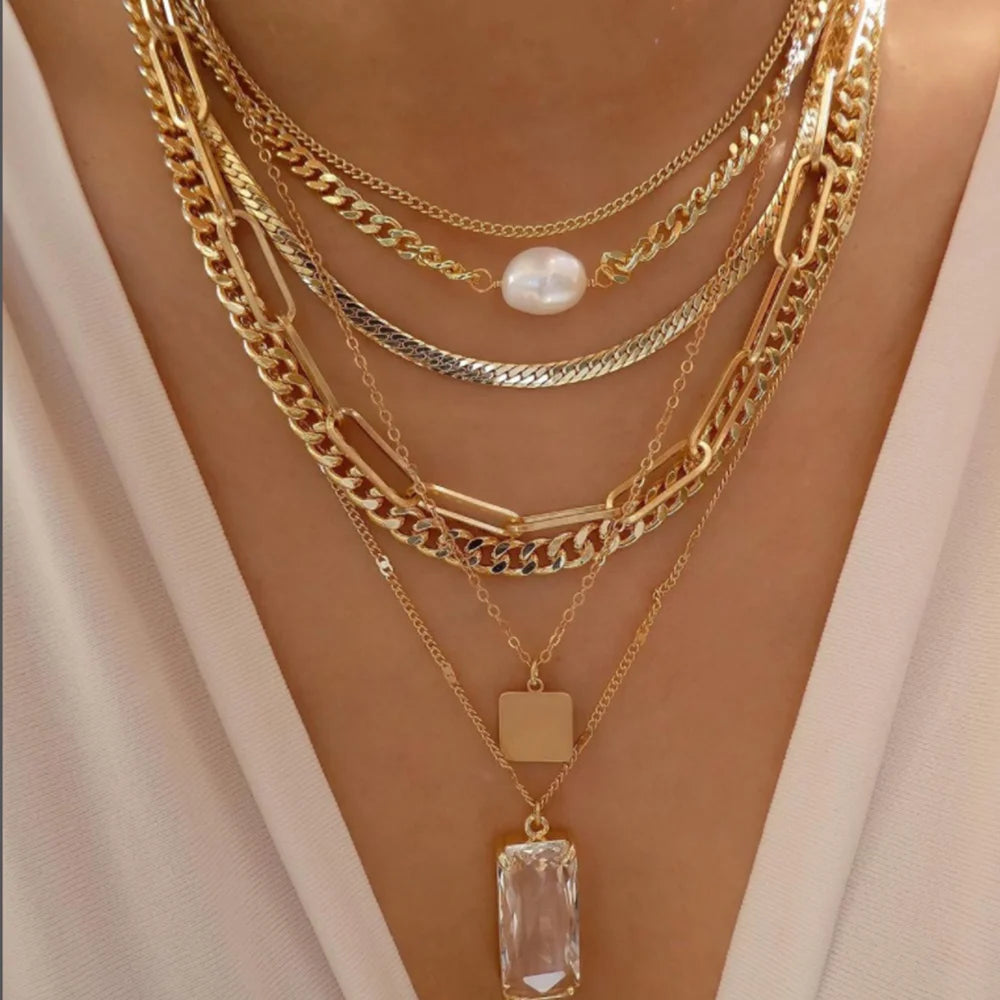 layered crystal pendant necklace set with rhinestones and metal chains