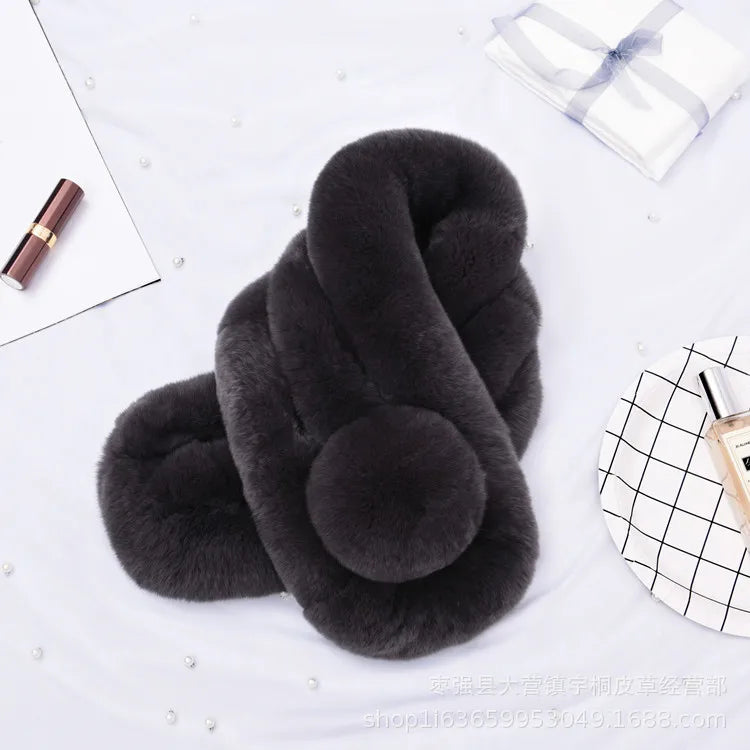 Dark gray rabbit fur scarf with a plush triple-tube design and a round pom-pom detail.