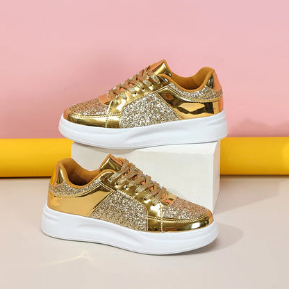Gold sequin and metallic lace-up casual sneakers with thick white soles.