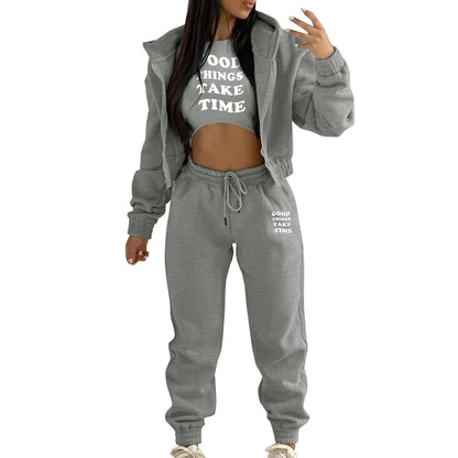 Grey knit sweater set with white letter print, hooded zip jacket, and high waist joggers for lounging.