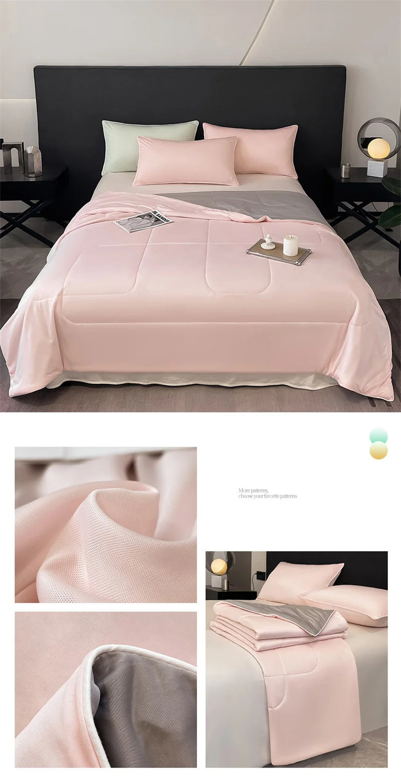 Light pink cooling comforter with breathable fabric and grey underside, designed for temperature control for hot sleepers.