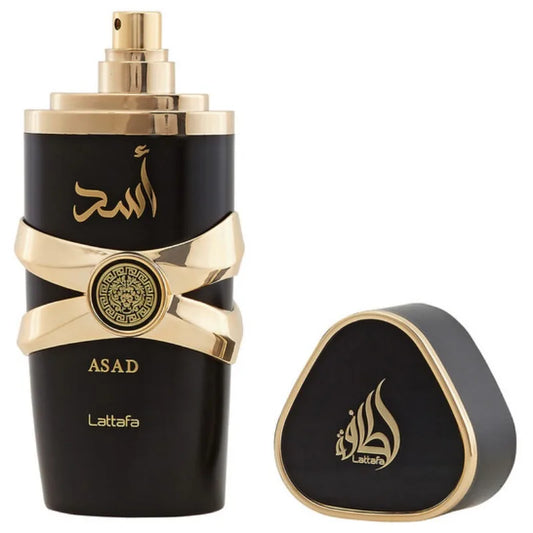 Black and gold cologne bottle with a crossed gold band design, next to its triangular cap.