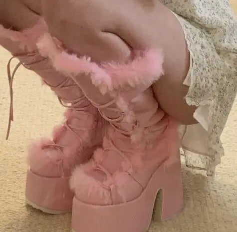 Pink platform wedge mid-calf snow boots with faux fur trim, lace-up front, and high heels.